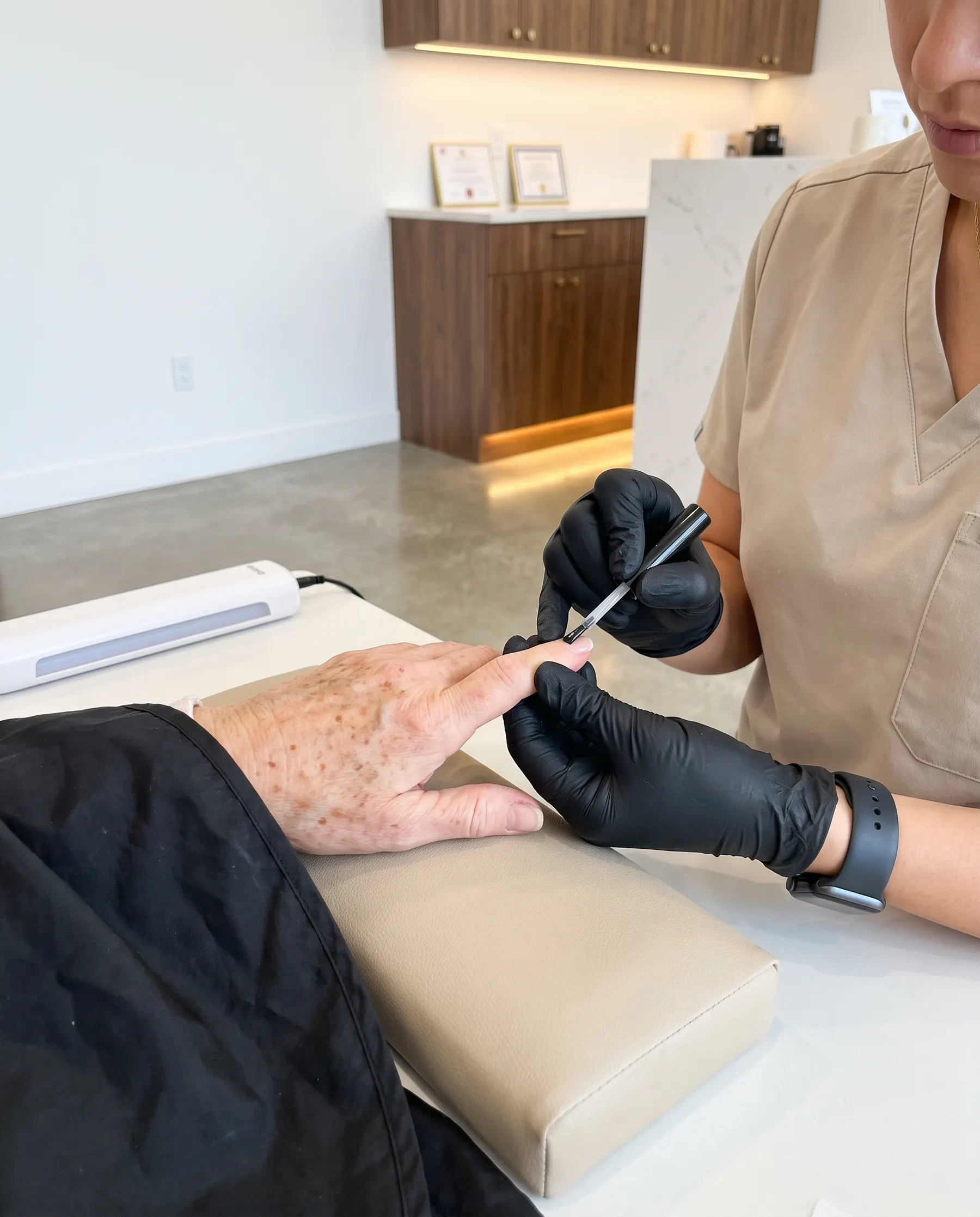 A coat of gel laid on a nail with a fine brush
