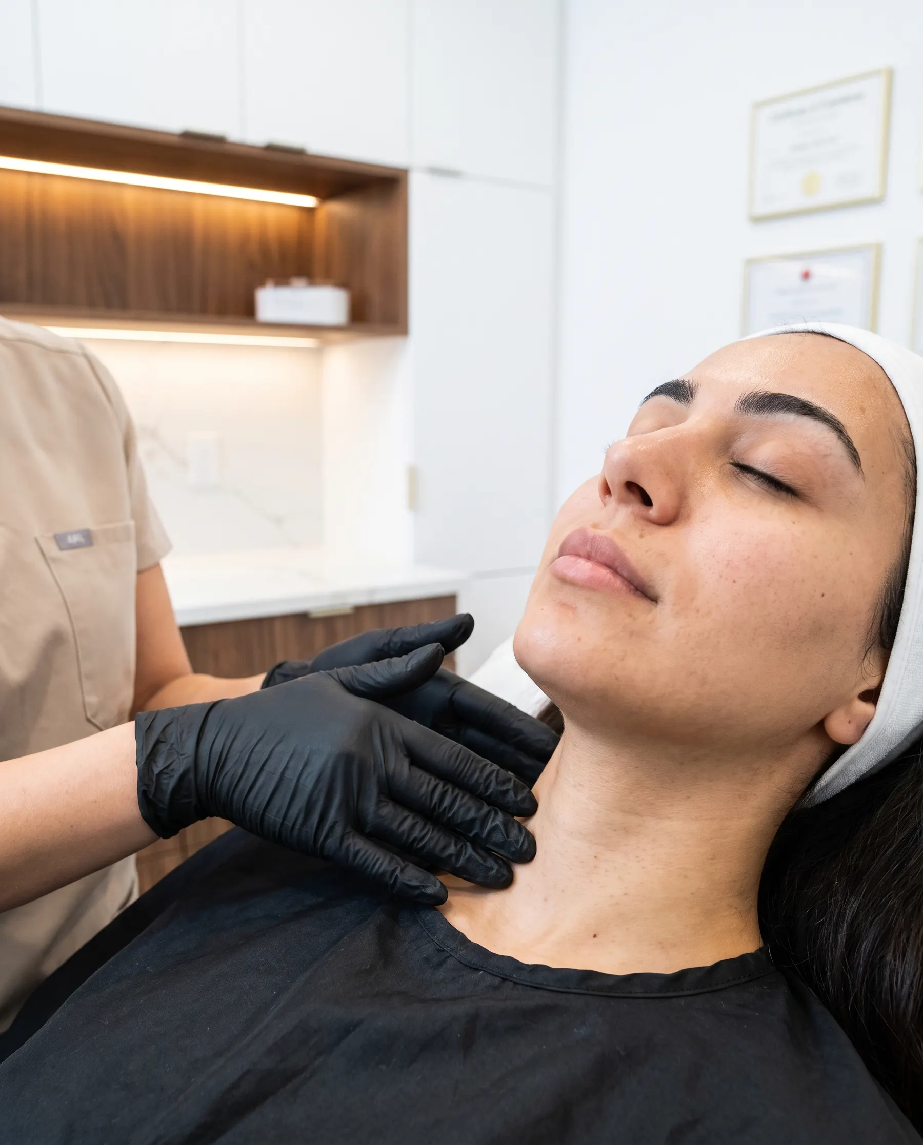 Flat hands at the base of the neck, the lightest possible contact