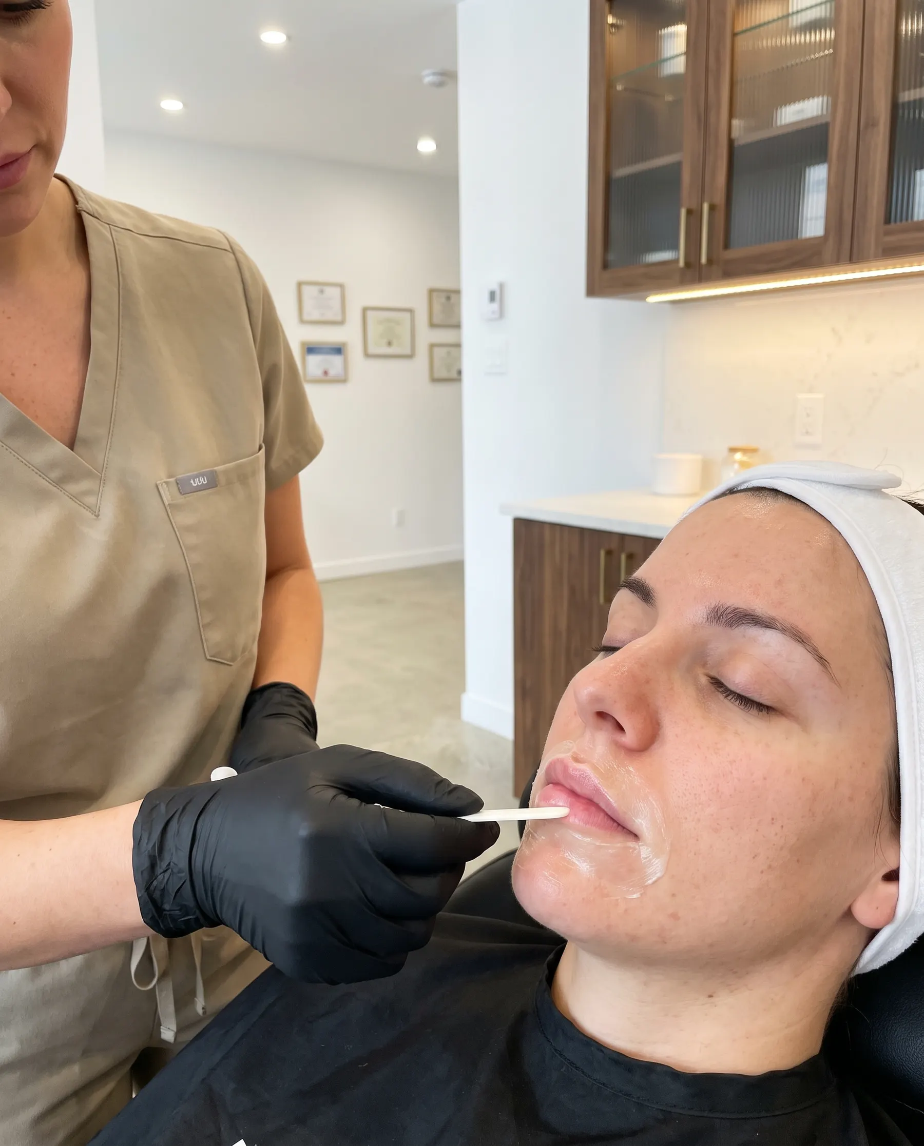 Numbing cream going on with an applicator