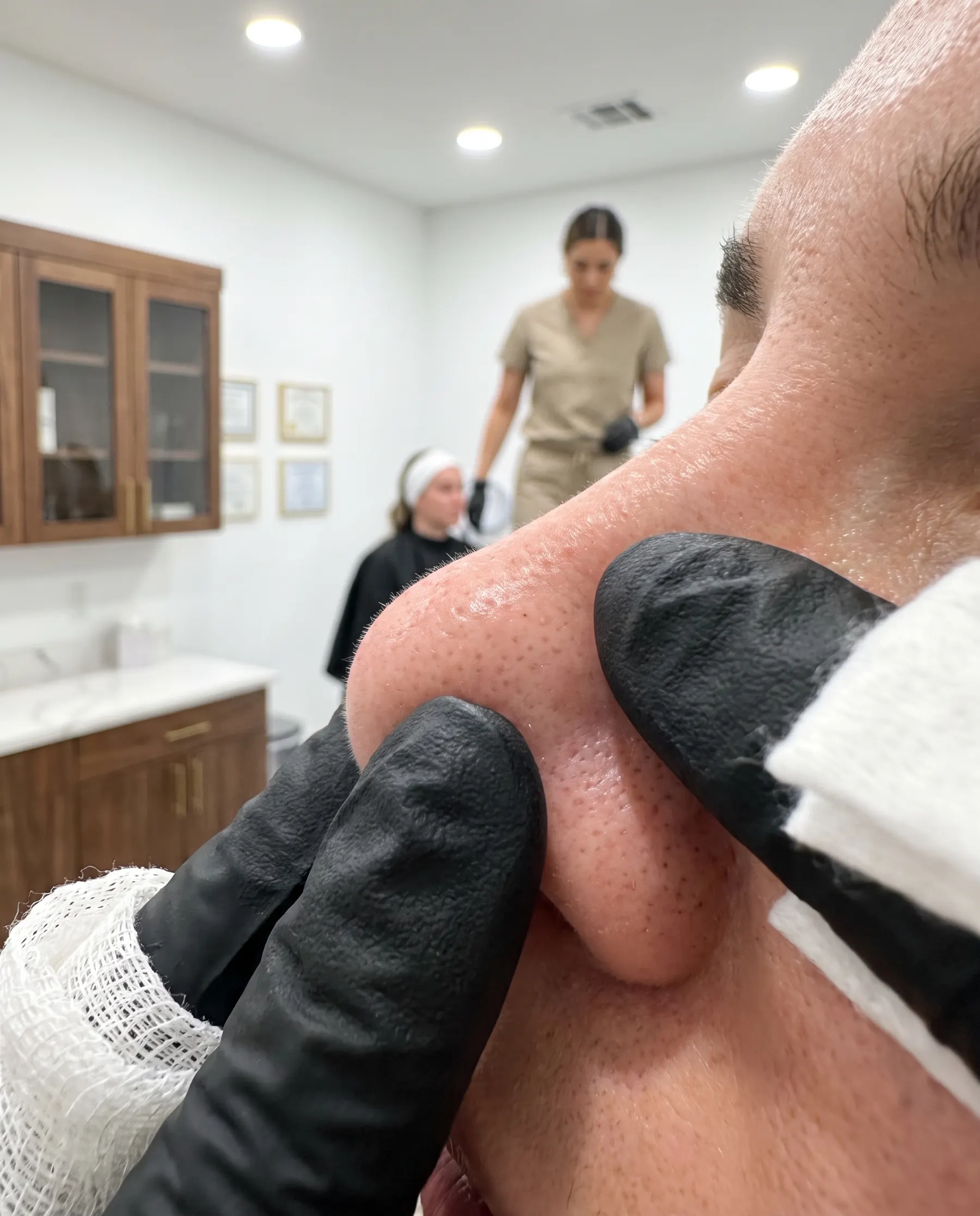 Extraction, macro framing, gloved fingers and gauze