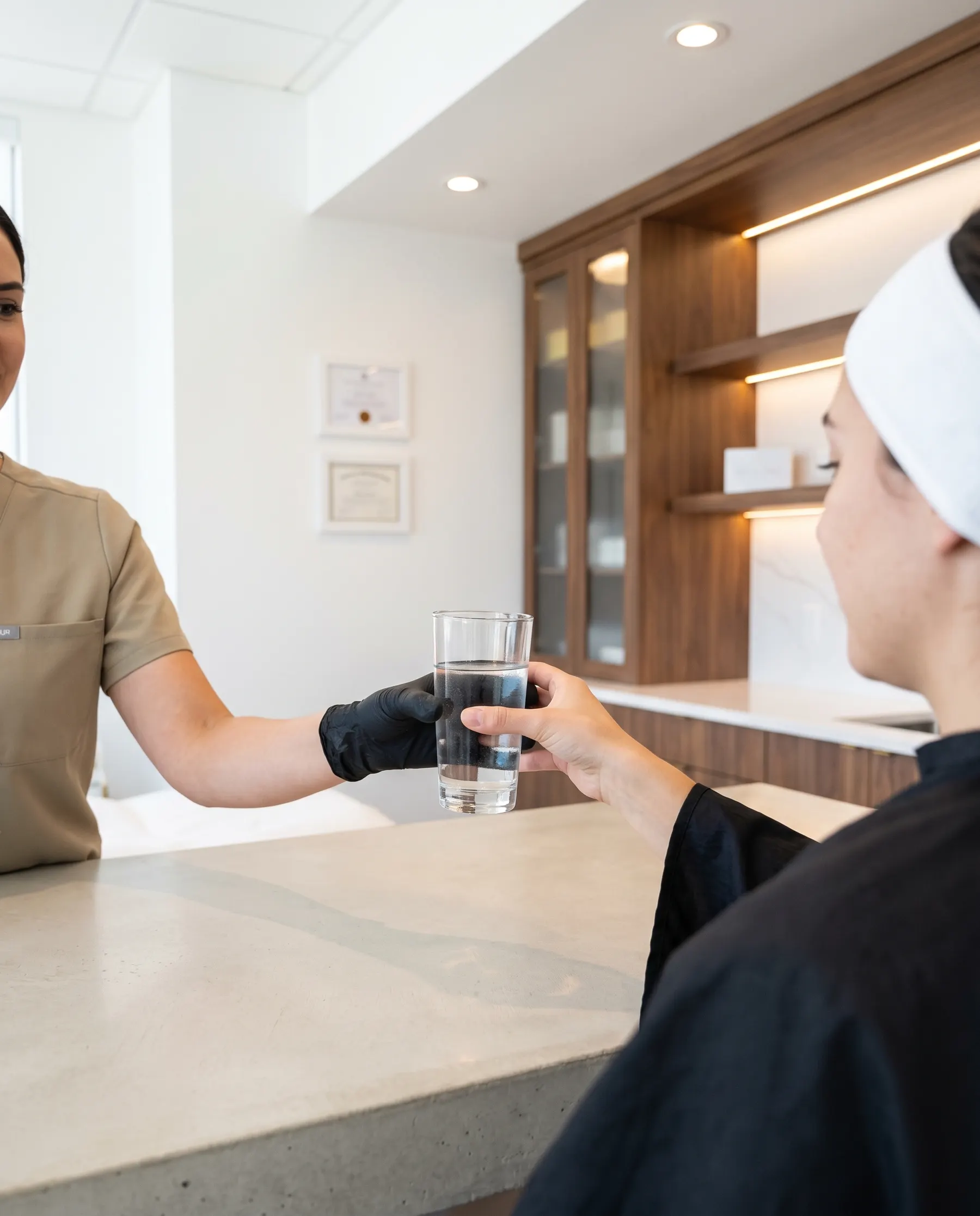 A glass of water handed over after the session