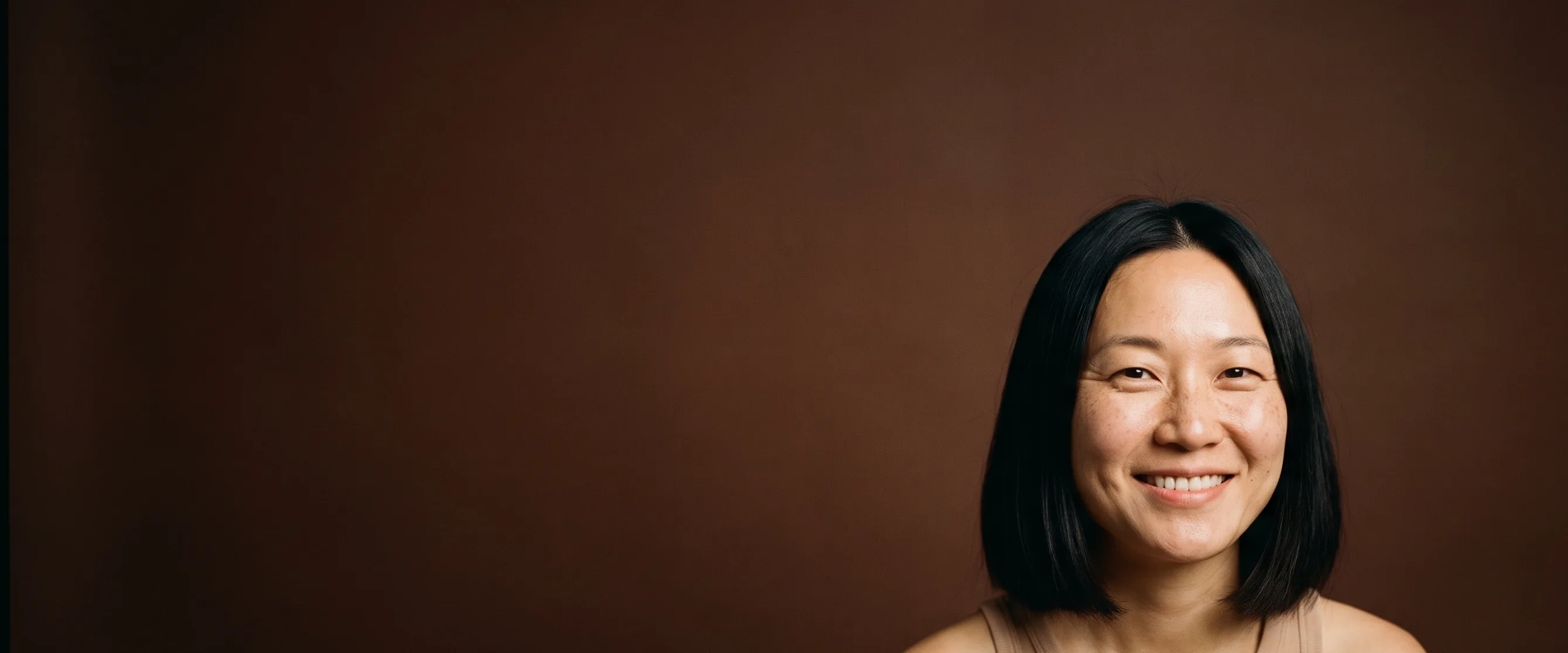 A close portrait, bare skin with no makeup, texture visible