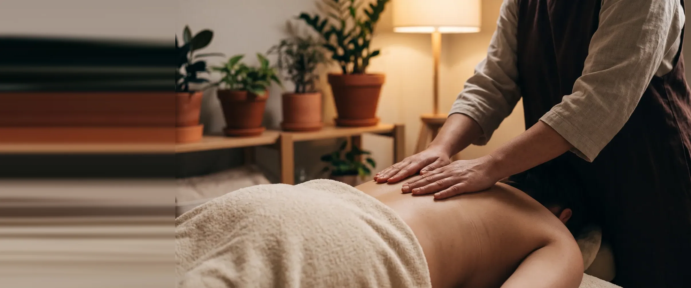 Massage in a treatment room, warm light
