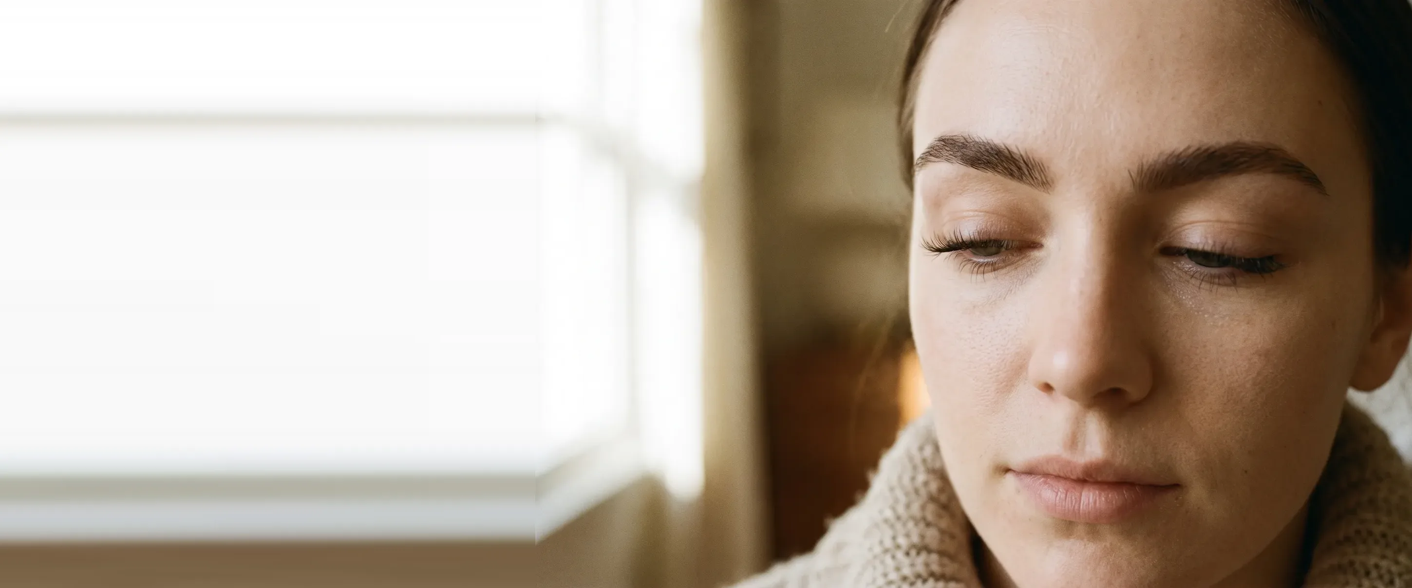 Brows and lashes in close-up, soft light