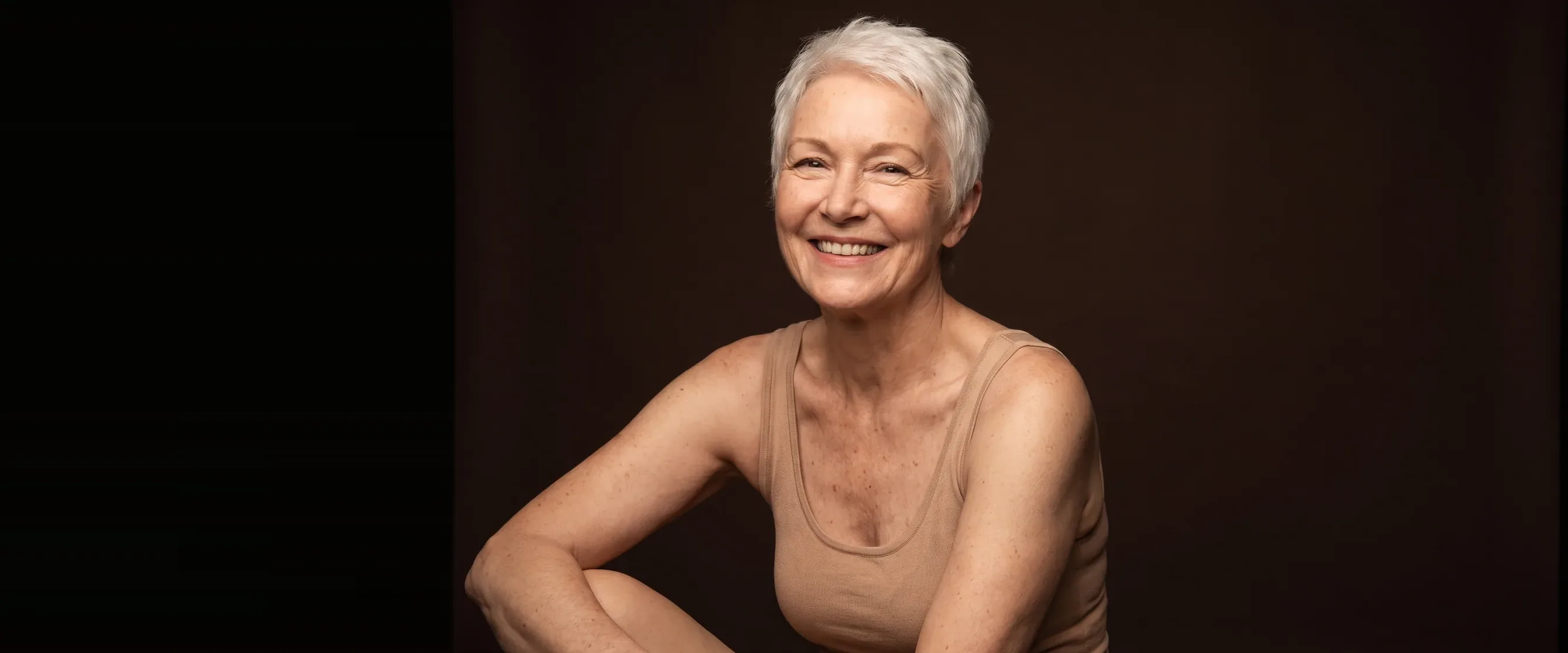 A white-haired woman, a soft smile, supple lips